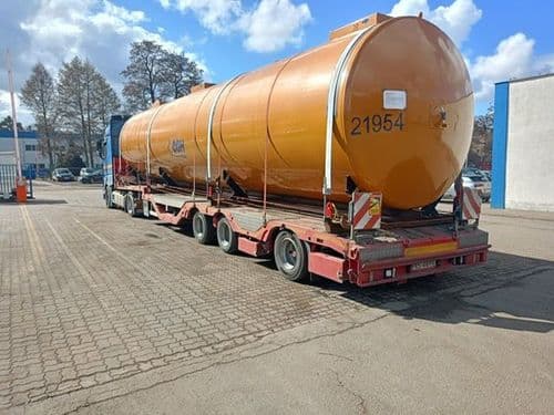 Horizontal silo loaded on a semi-low loader for exceptional transport from Poland to Belgium