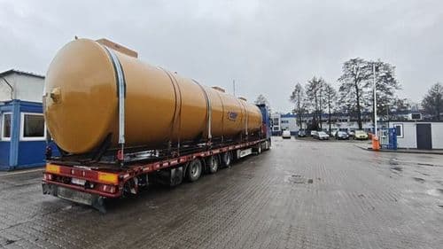 Semi-low loader carrying a 13-metre silo ready to depart from Poland